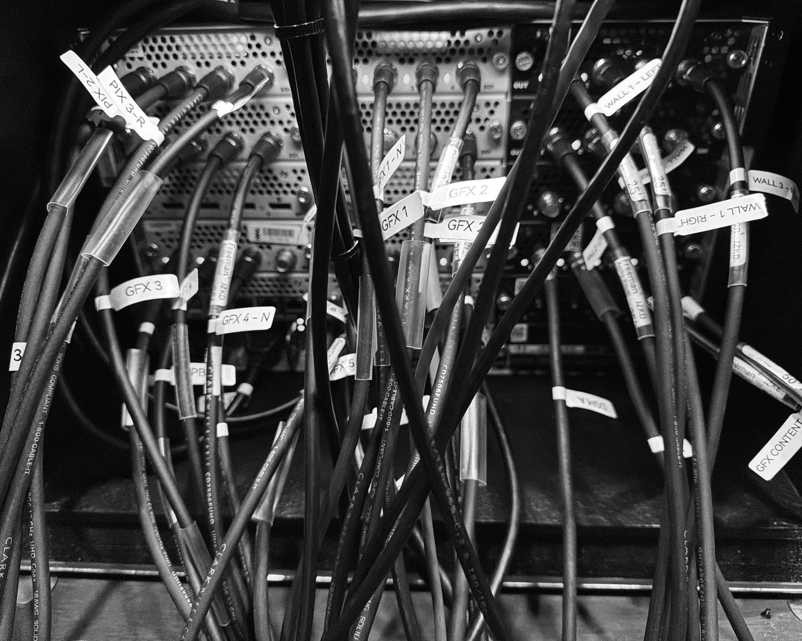 Rear patch panel with labeled GFX and wall feeds, Freeman AV cabling, on the ai+expo Aquilon RS4 rig