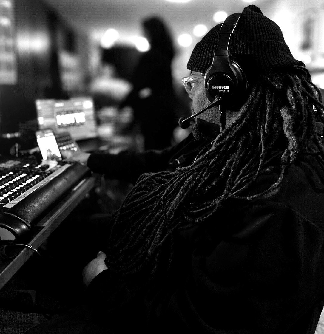 George E. Kennedy, Jr. at front of house, headset on